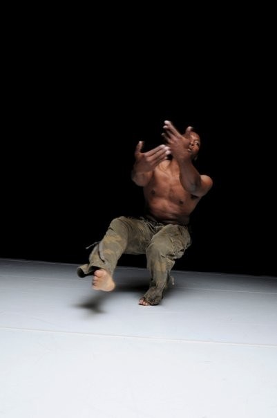 Boris Willis crouched low to the studio floor