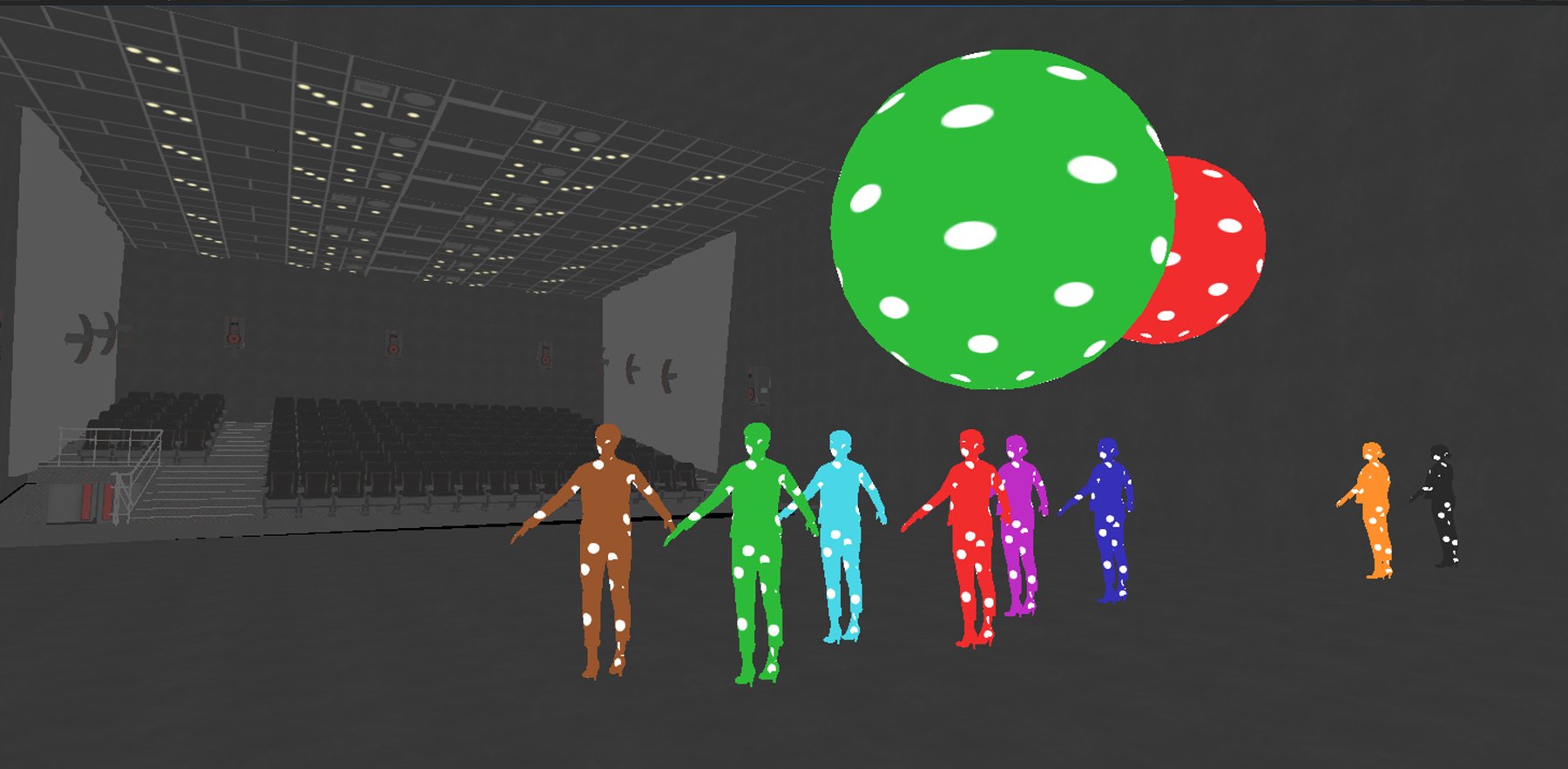 A line of actors in dot costumes, each a different color, spaced across the stage beneath two large polka-dot spheres, empty seats at left