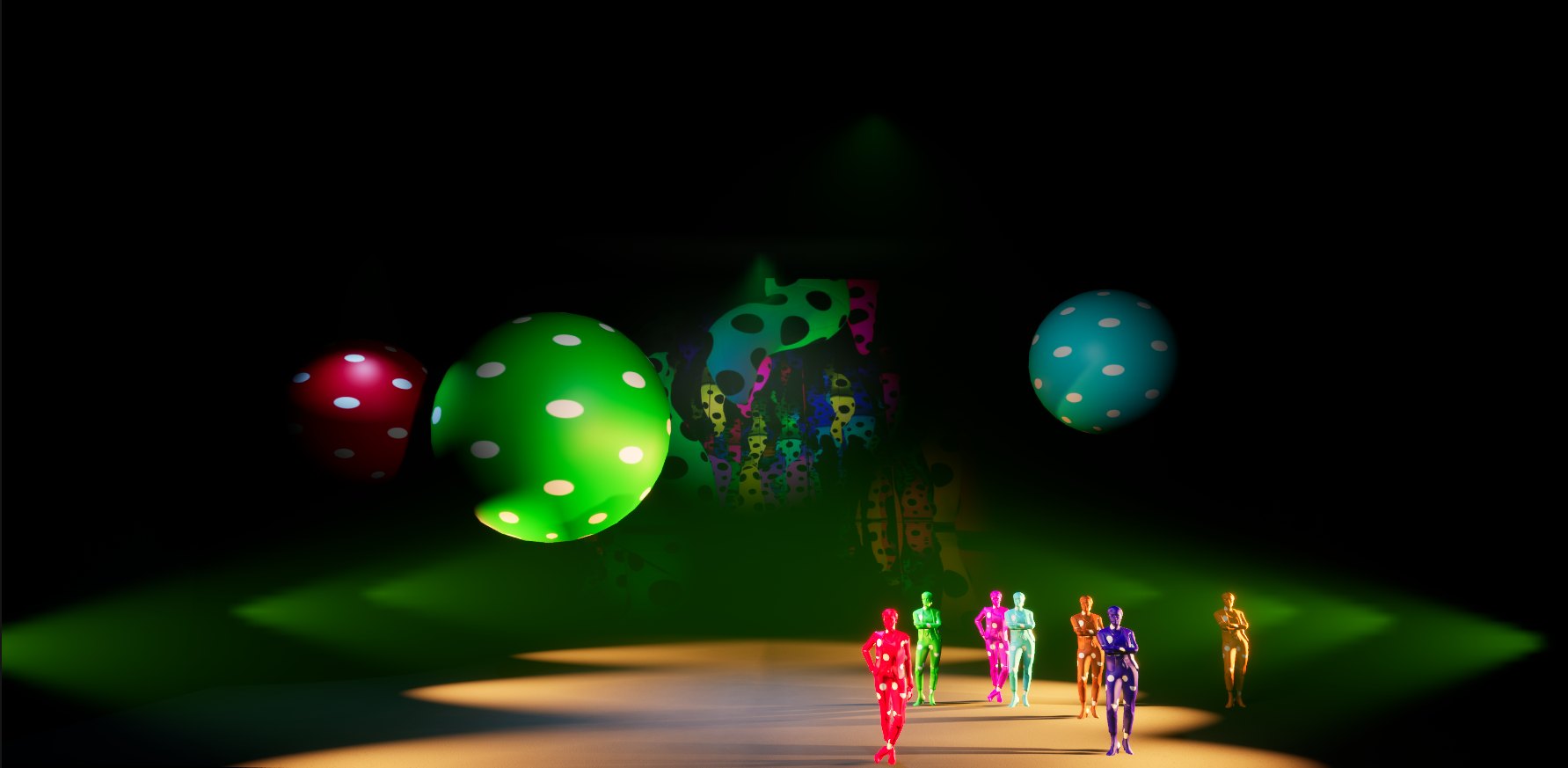 Seven dot-costumed dancers gathered downstage in warm light, polka-dot spheres and a dotted backdrop behind