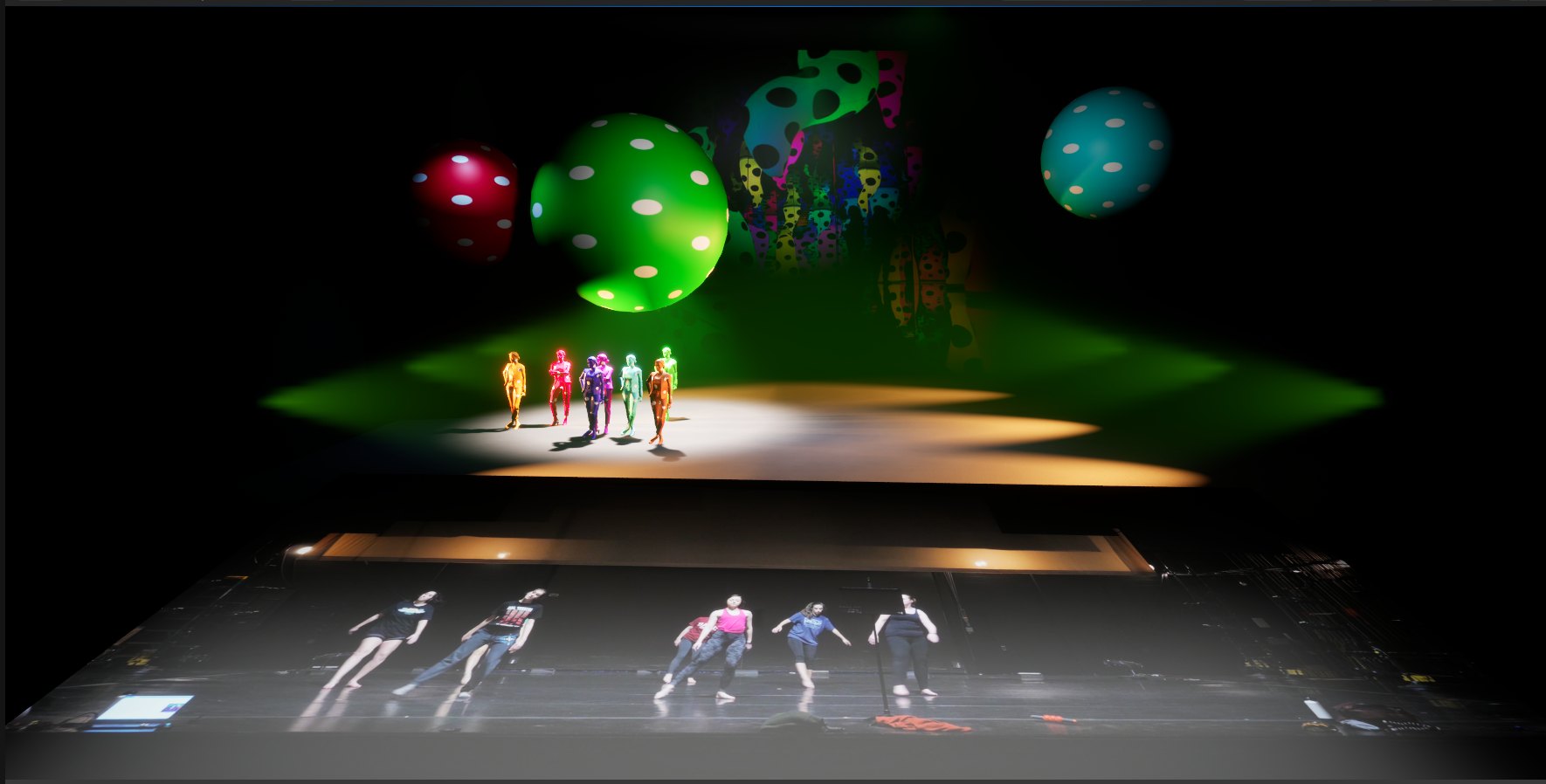 The virtual staging with dot-costumed actors and spheres above; the recorded rehearsal footage of real dancers projected on the stage below