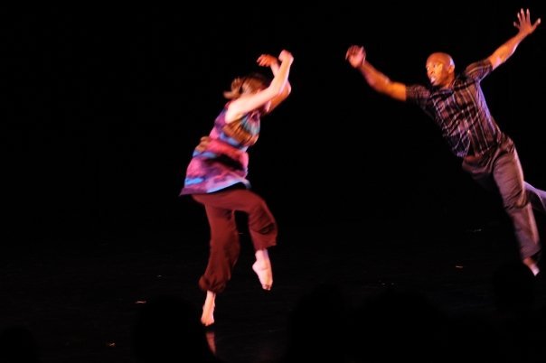 Boris Willis and Cynthia McLaughlin leaping apart across the stage