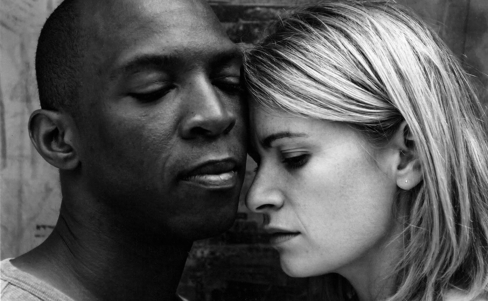 Black-and-white portrait of Boris Willis and Cynthia McLaughlin, foreheads nearly touching, in Enter Race