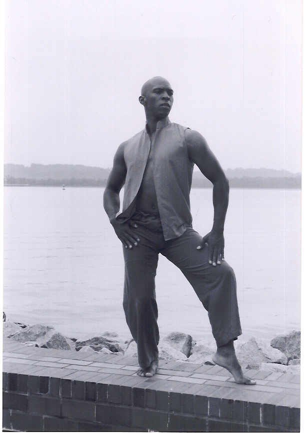 Boris Willis posed on a waterfront wall