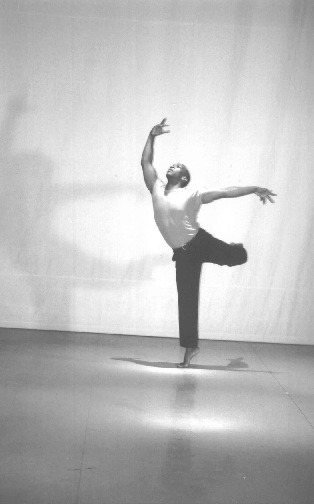 Boris Willis in a standing balance, one arm raised and one extended, Aliens