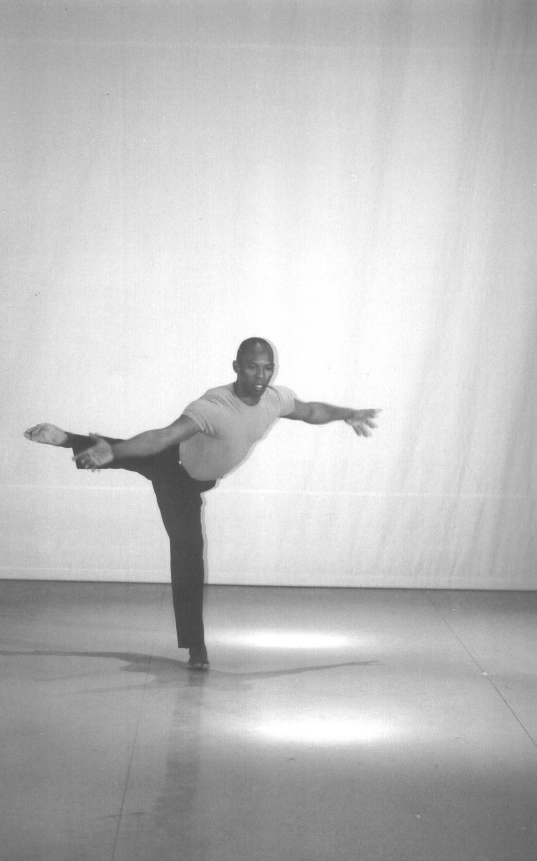 Boris Willis in an arabesque with arms outstretched, Aliens