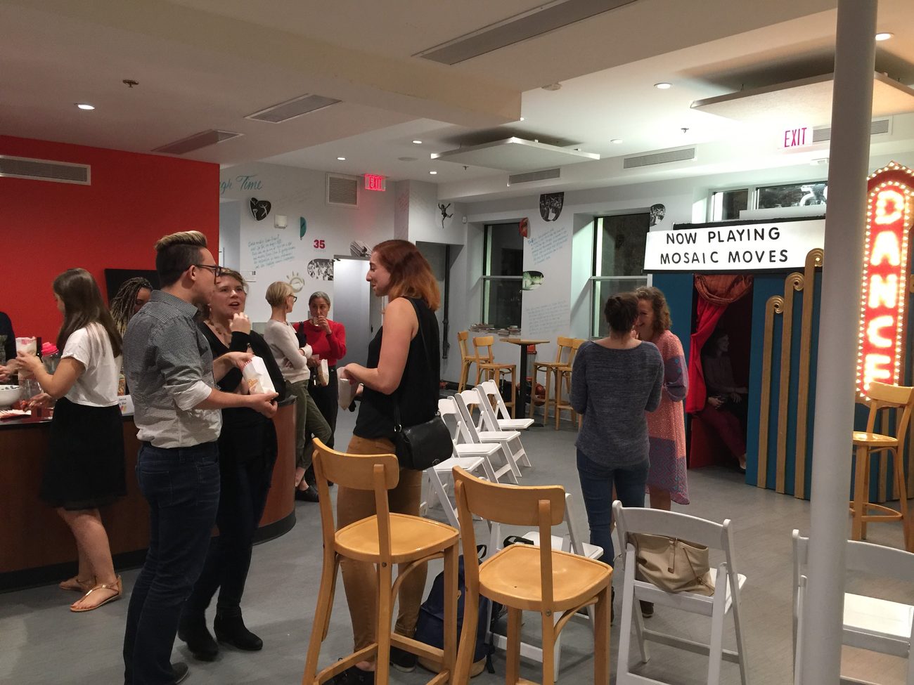 A Now Playing: Mosaic Moves marquee in a dance center lobby